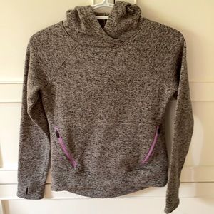 Grey hoodie with zip up pockets.